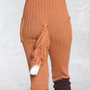 Close up of a knit fox tail in orange