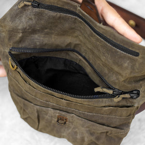 Close up of a fanny pack zipper pocket