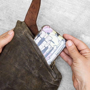 Close up of a cell phone zipper pocket of a fanny pack