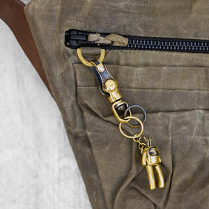 Close up of a D-ring key holder on a fanny pack