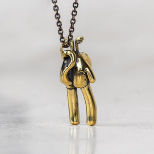 BLAMO Rice Baby creature charm pendant attached to a chain on a white background