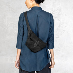Leather waxed canvas Cross Body Bag worn by a woman on the back of her body