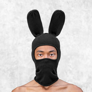 Person wearing a BLAMO Bunny Balaclava black against a light gray background