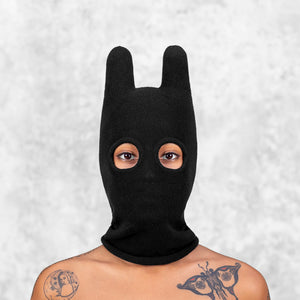 Person wearing a Blamo Socky Balaclava Solid Black against a light gray background
