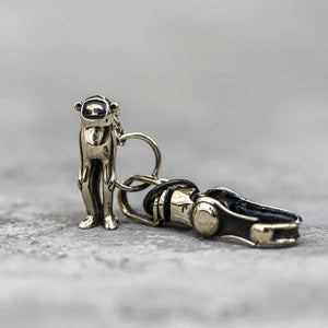 BLAMO Minky Keychain brass monkey figurine keychain clip standing against a gray background