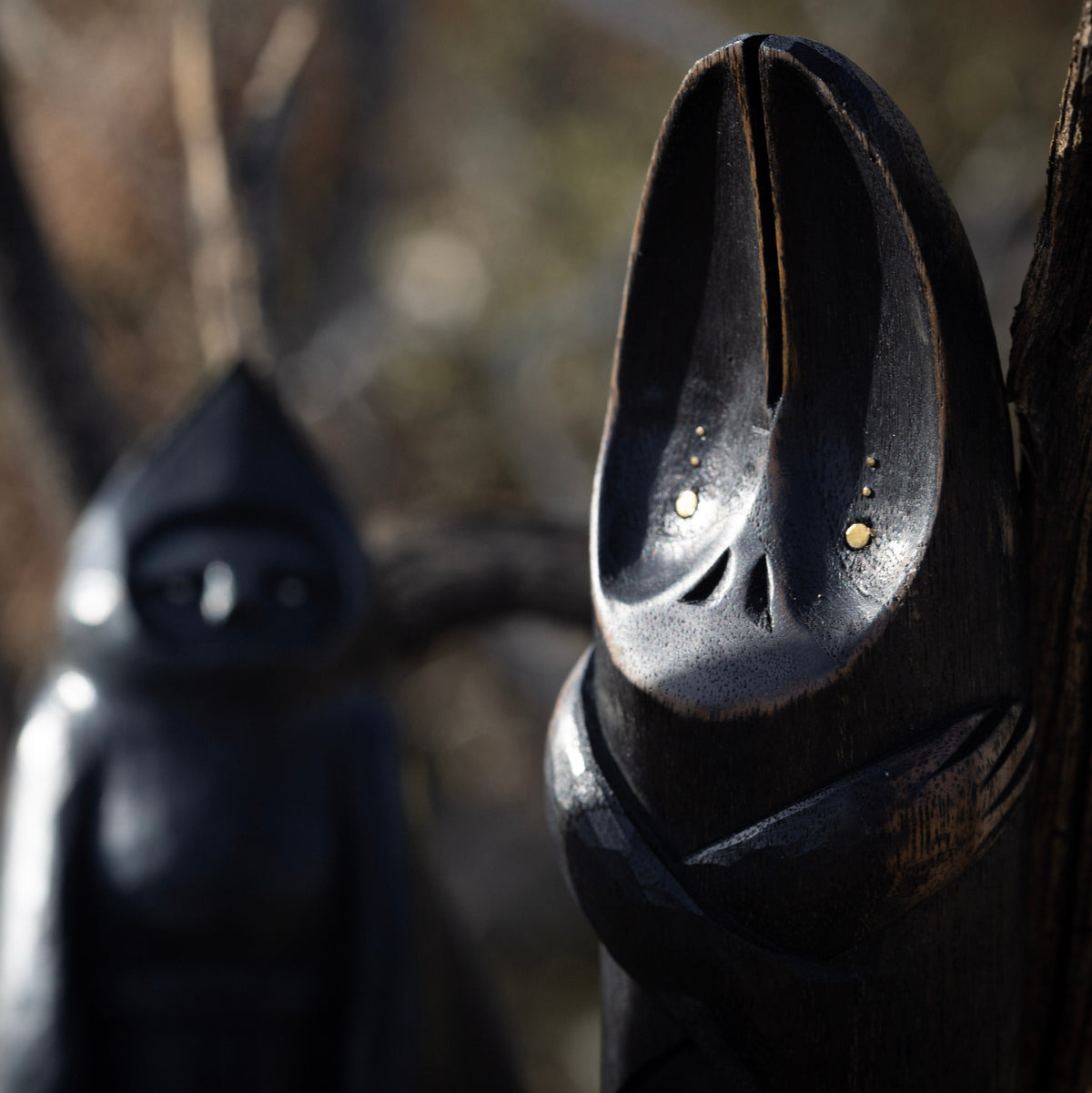 Close up on a wooden bat figurine with a blurred background