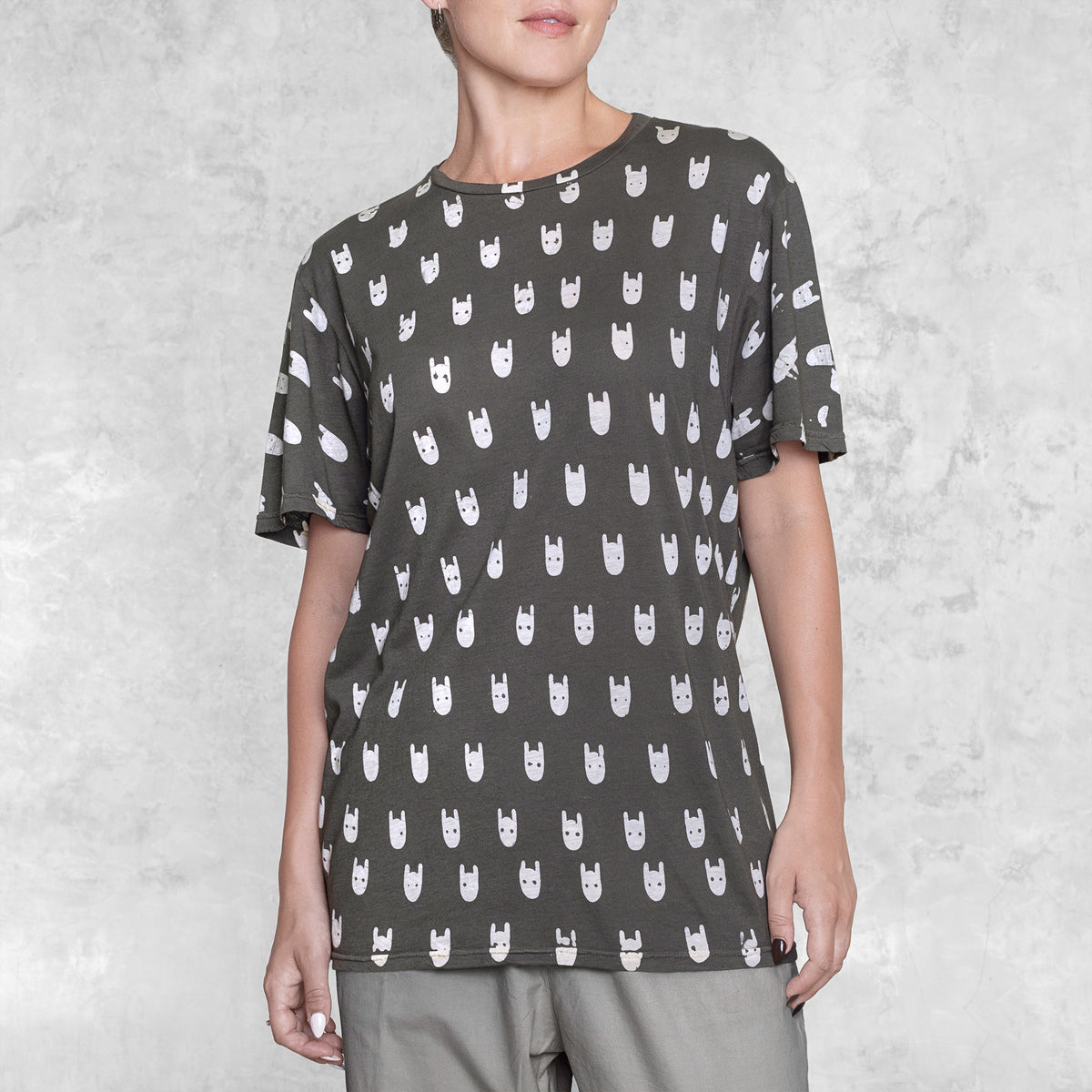 Woman from waist to chin wearing a batik cotton shirt