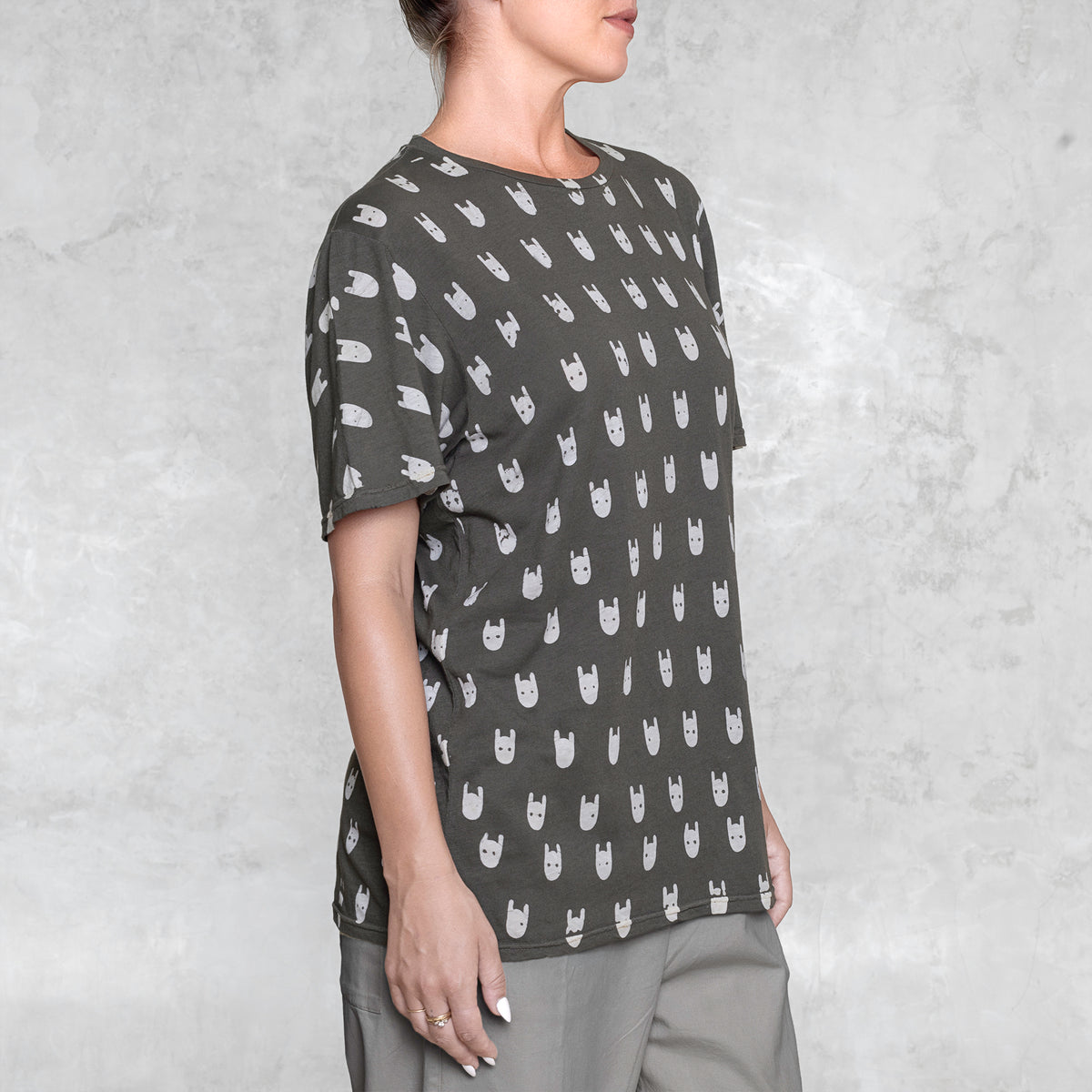 Woman from waist to chin wearing a batik cotton shirt