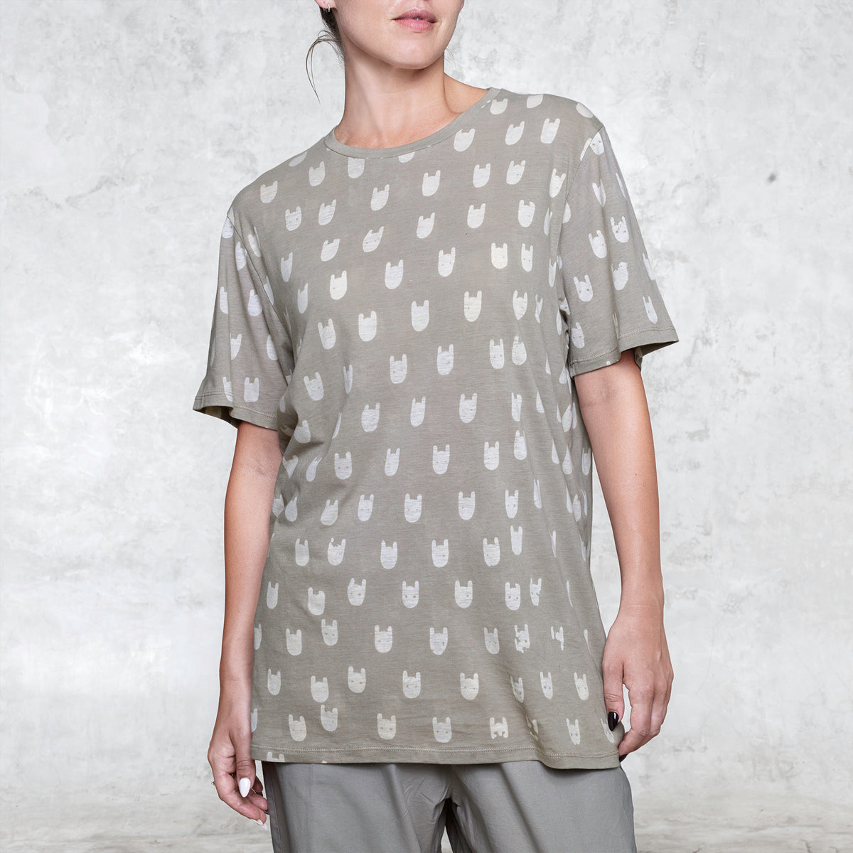 Woman from waist to chin wearing a  batik cotton shirt