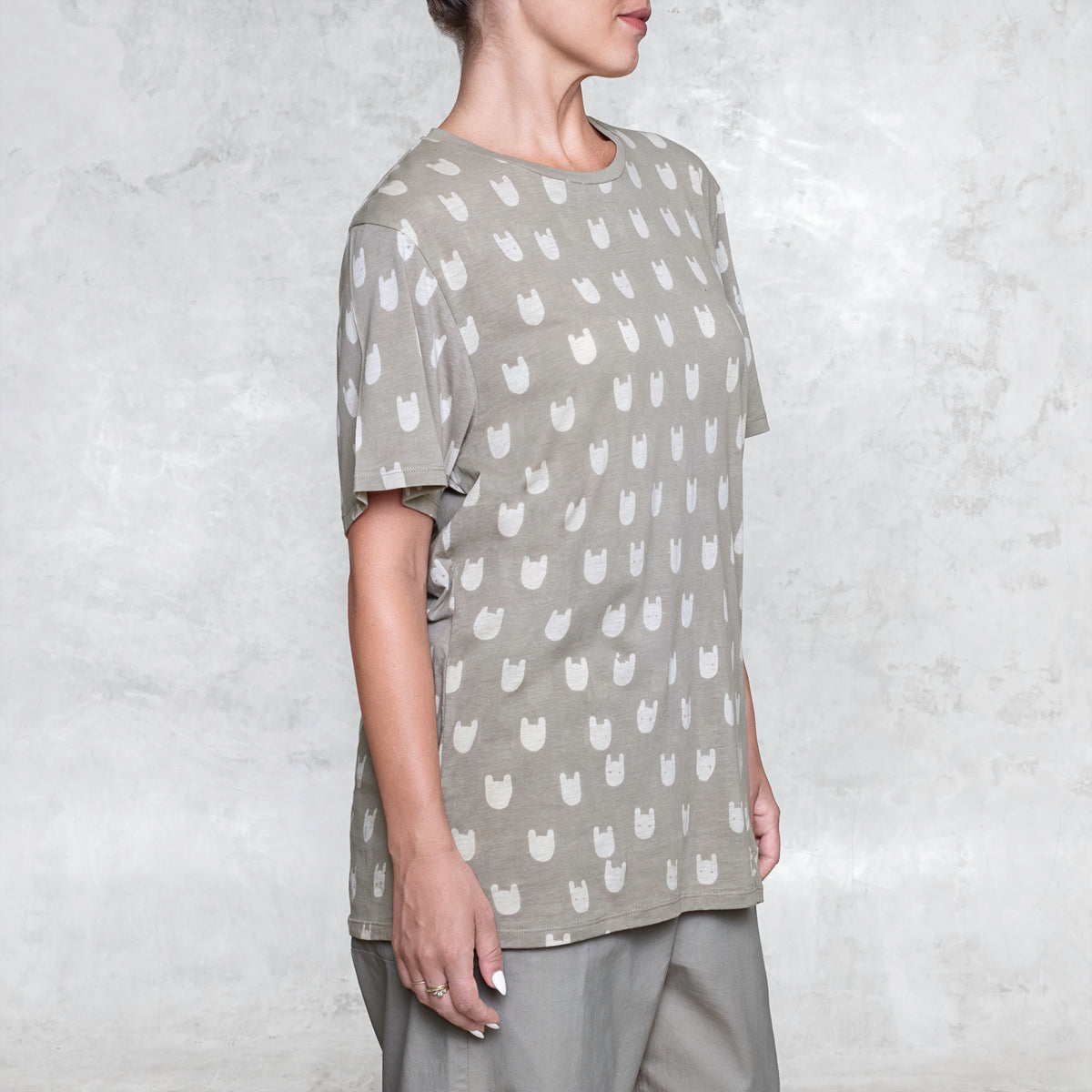 Woman from waist to chin wearing a batik cotton shirt