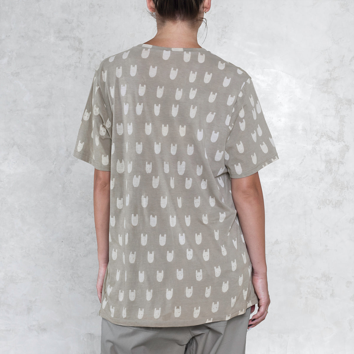 Woman from waist to chin wearing a batik cotton shirt