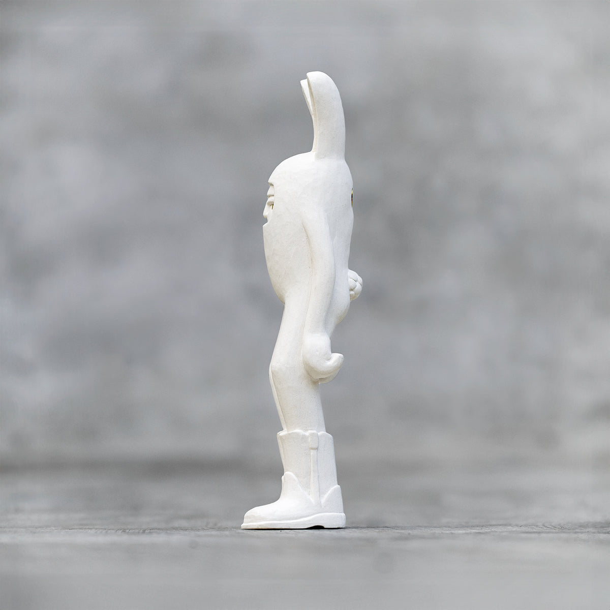 A 7"  Ceramic Blamo Rabbit Sculpture wearing cowboy boots