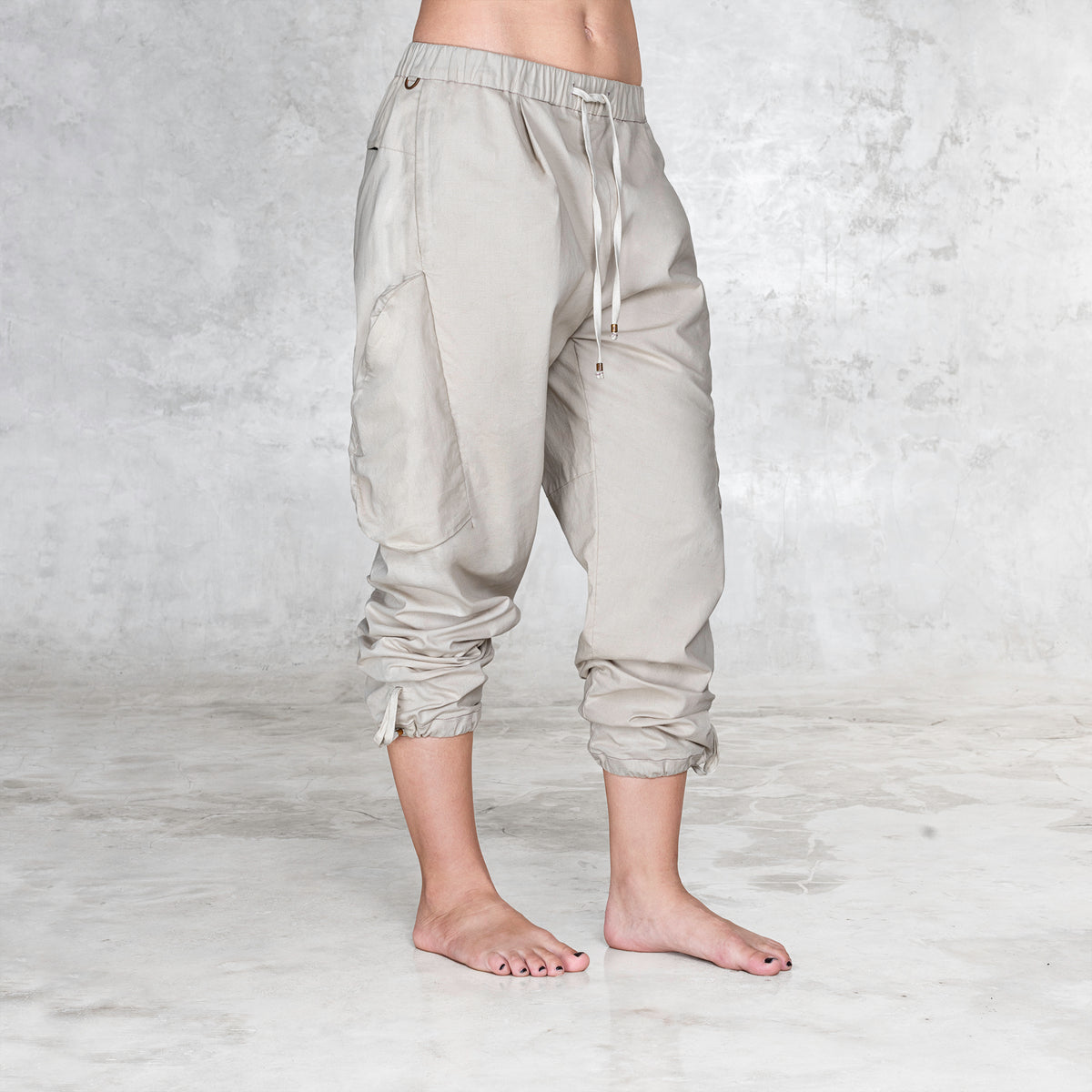 A side view of a cargo style BLAMO pant from the waist down 