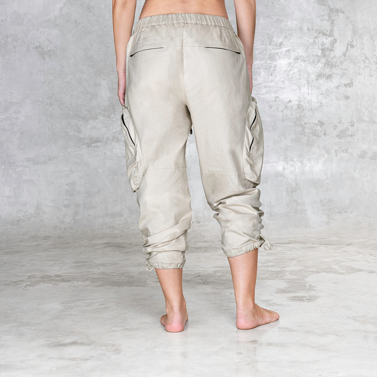 A back view of a cargo style BLAMO pant from the waist down 