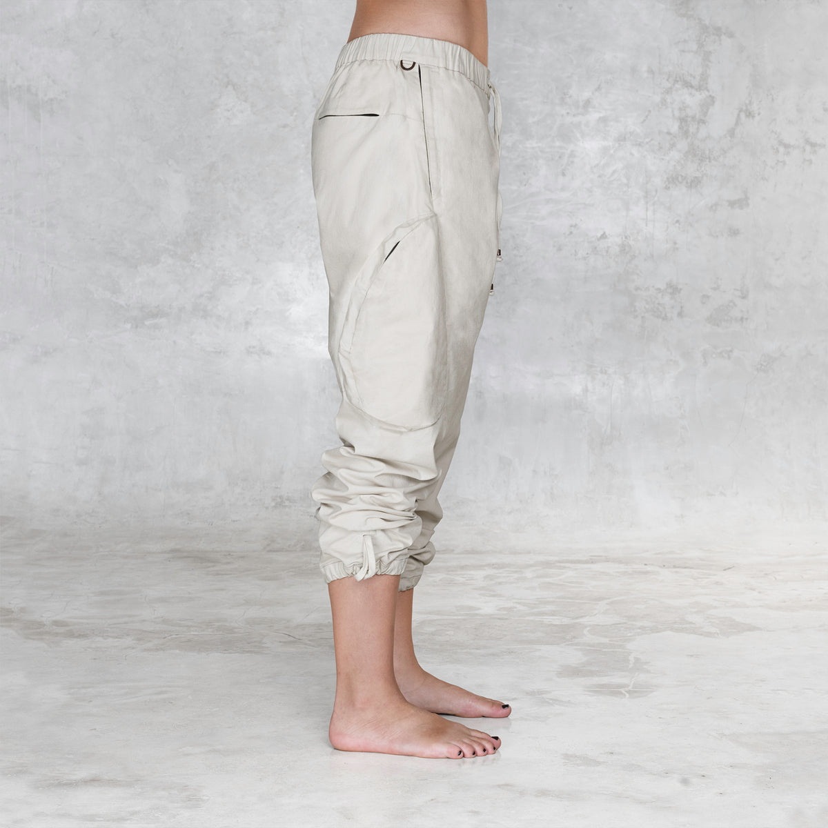 A side view of a cargo style BLAMO pant from the waist down 