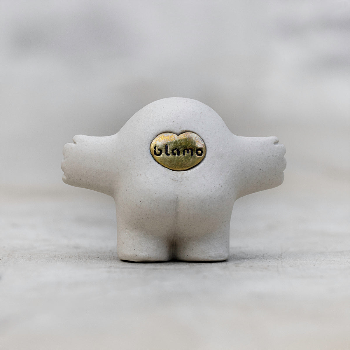 White Ceramic and Brass Art Figurines