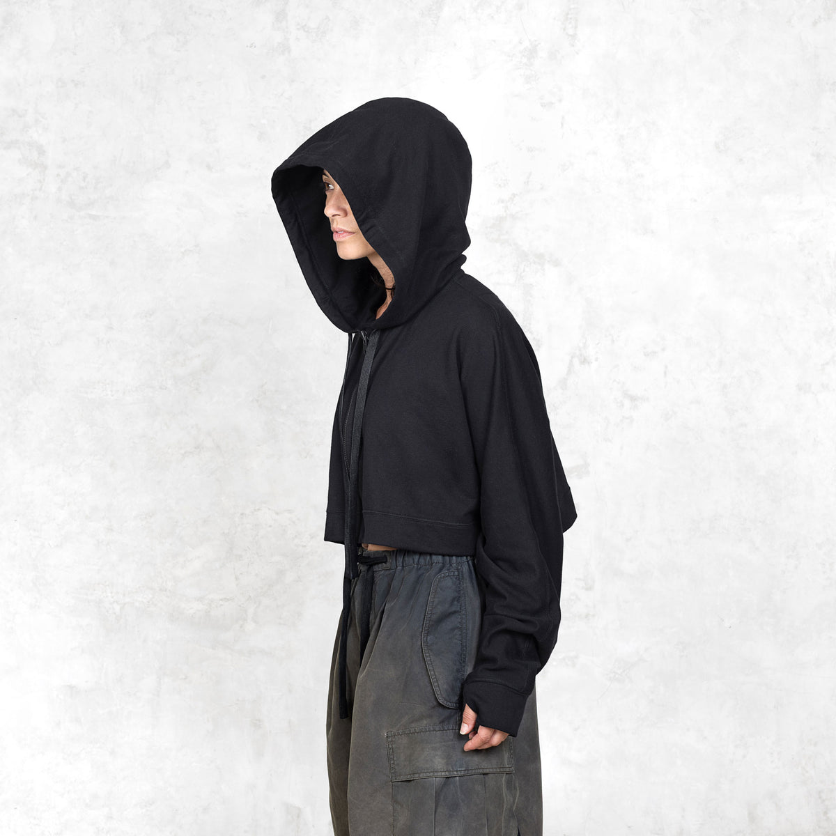 Model shown from the waist up wearing black cropped French terry Daydreamer Hoodie with deep hood 

