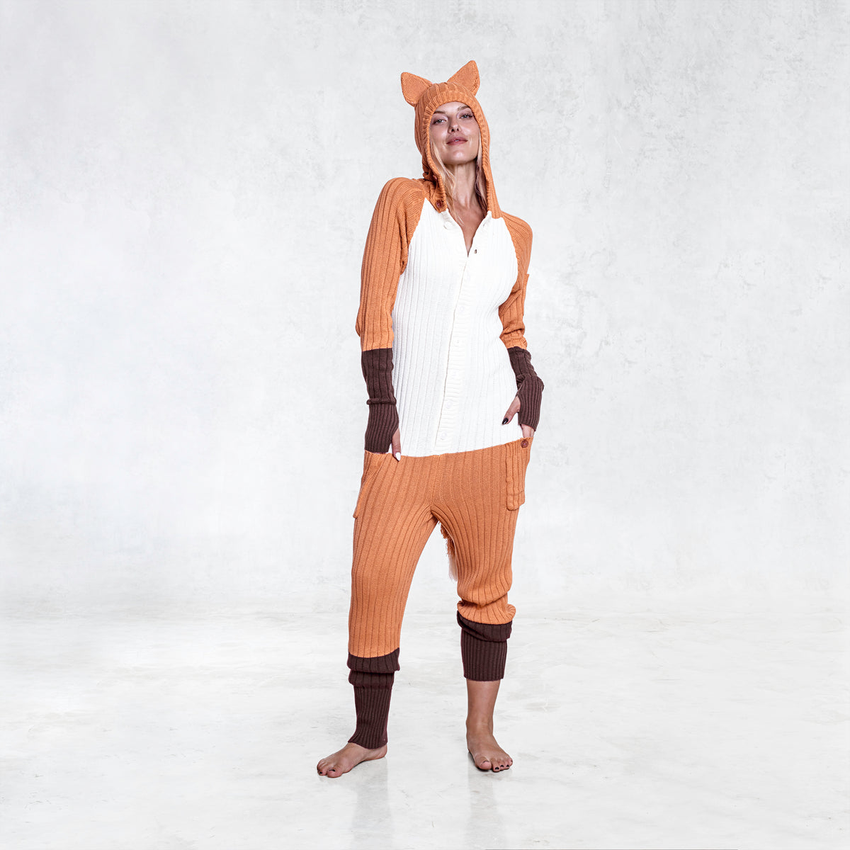 A woman in an Adult Cotton Knit Fox Onesie 