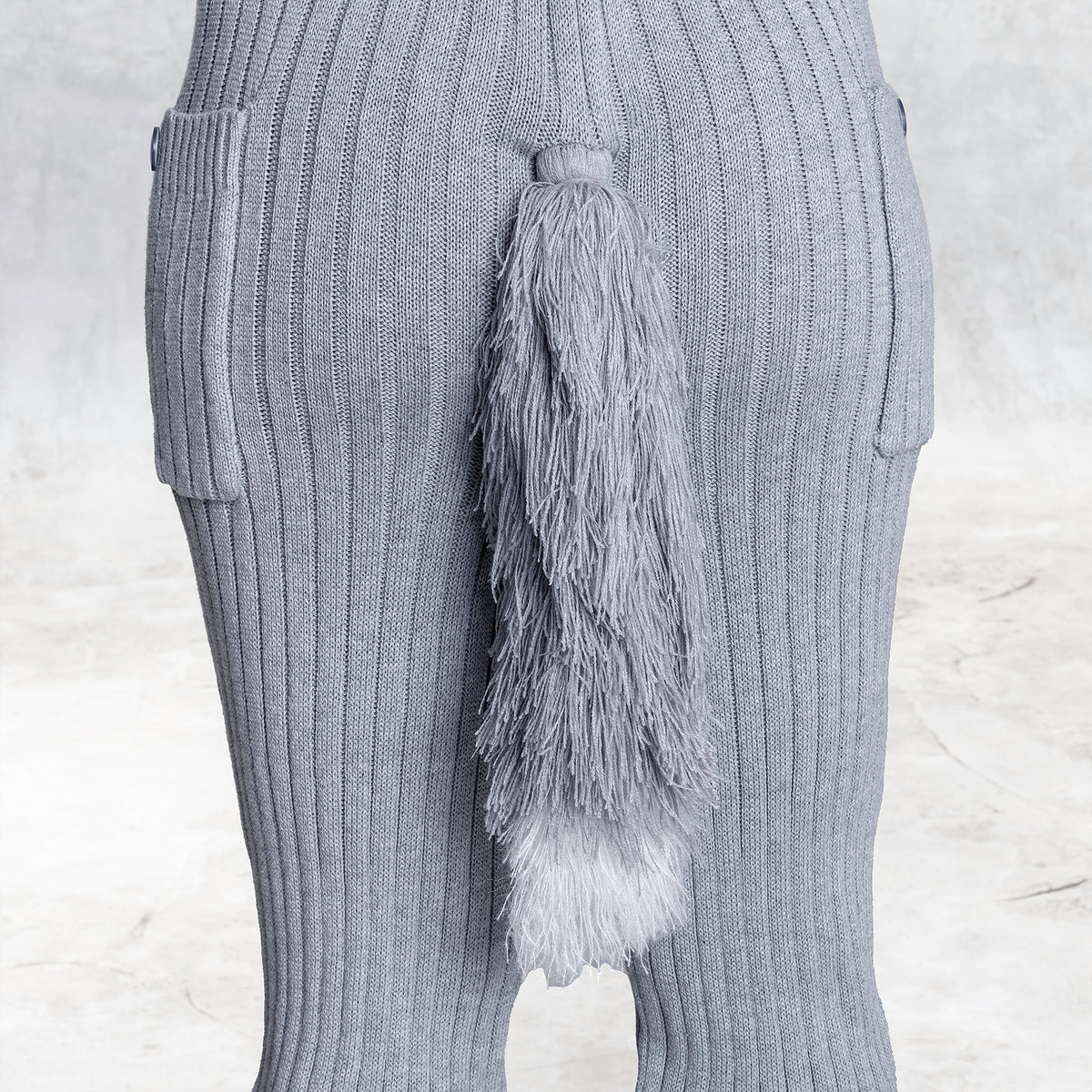 Close up of a knit silver fox tail 