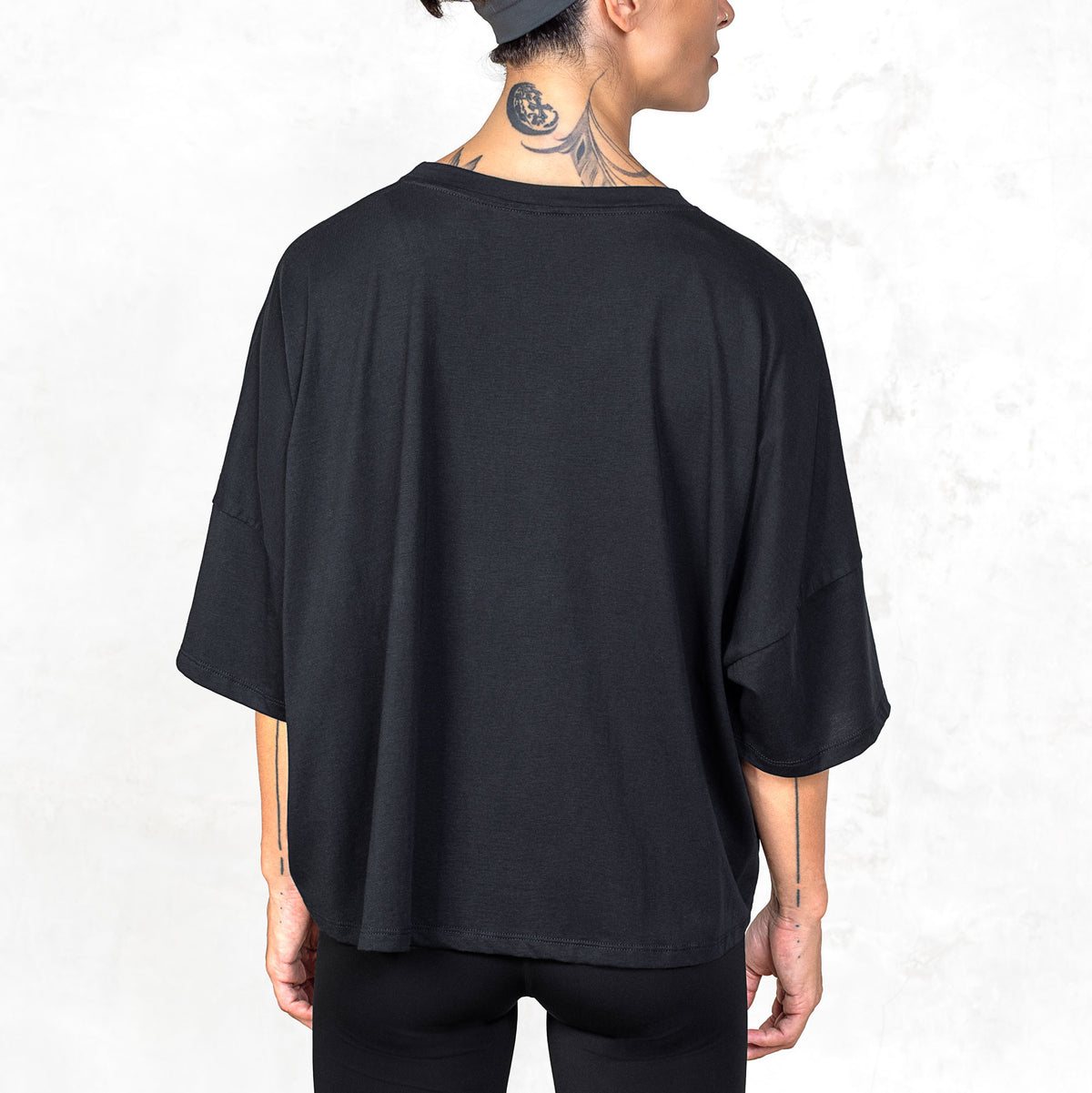 Waist-up back view of the Katana cropped Supima cotton tee showing dropped shoulders and relaxed fit.