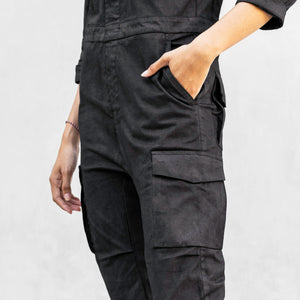 Close up of the waist and thigh pockets of a one piece black walnut mechanic style BLAMO jumpsuit 
