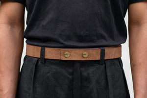 Natural colored leather strap belt with brass buttons