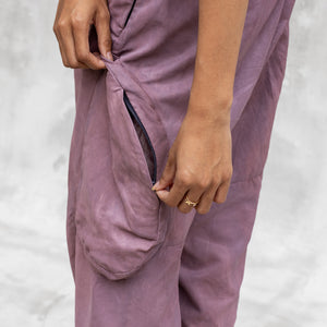A close up of th eside bellow cargo pocket on a pair of BLAMO silk pants