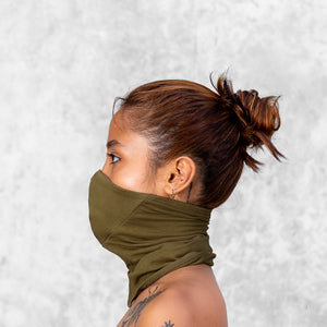 Woman from neck up wearing an Olive face buff mask 