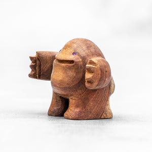 Hand Carved Teak Wood Art Toy with arms extended like a HUG and Rose sapphire eyes