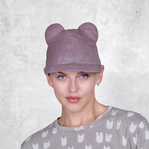 A woman with a BLAMO pink silk cap with ears