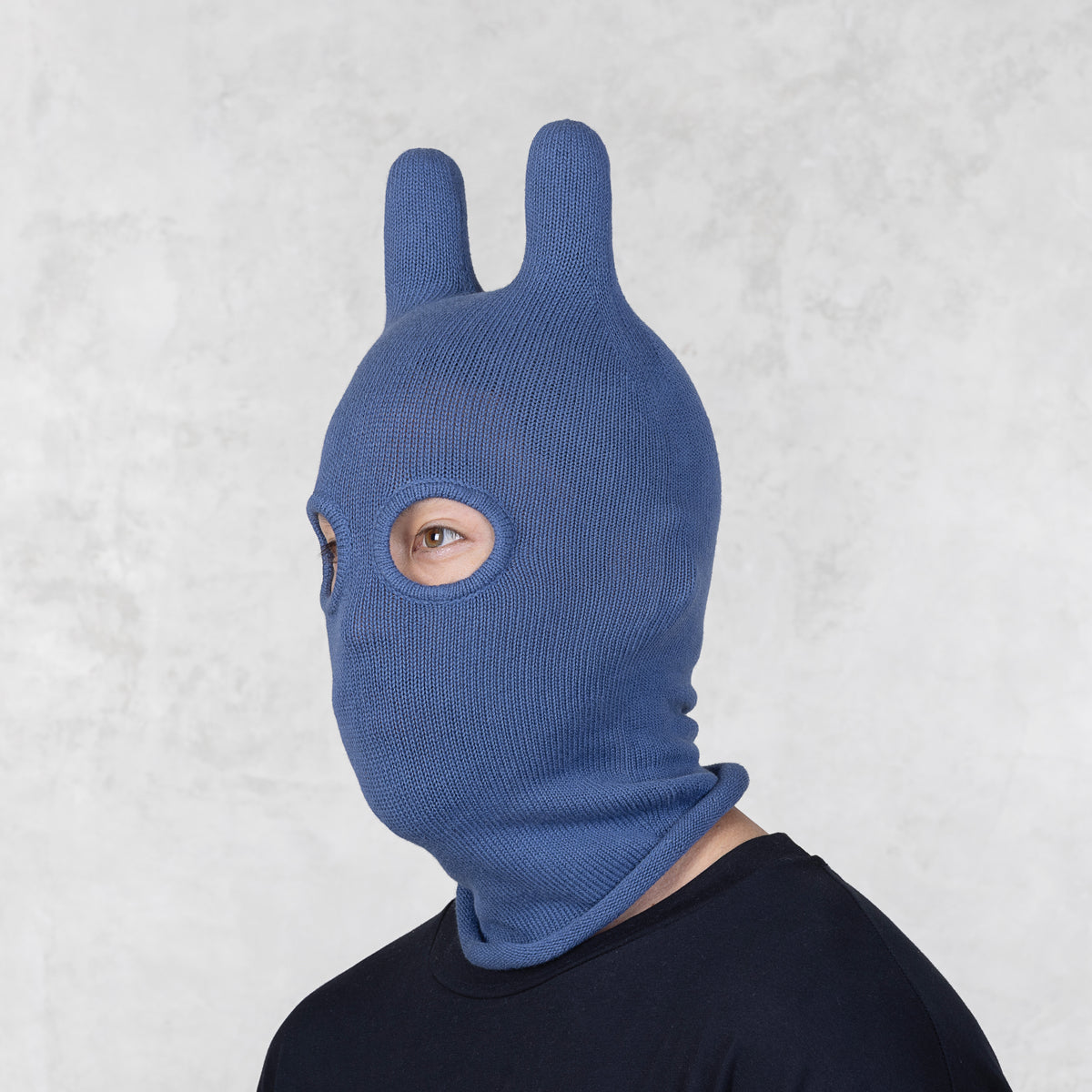 Person wearing a Blamo Socky Balaclava Azure  mask against a light gray background