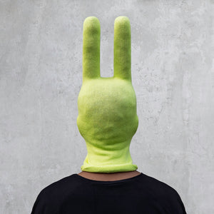 A man wearing an arctic lime green balaclava with horns