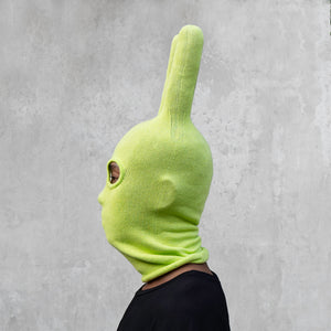 A man wearing an arctic lime green balaclava with horns