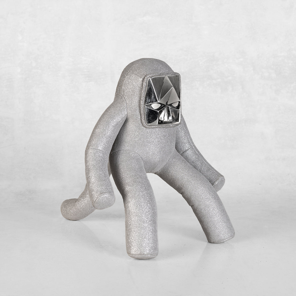 a silver leather and white brass toy art sculture