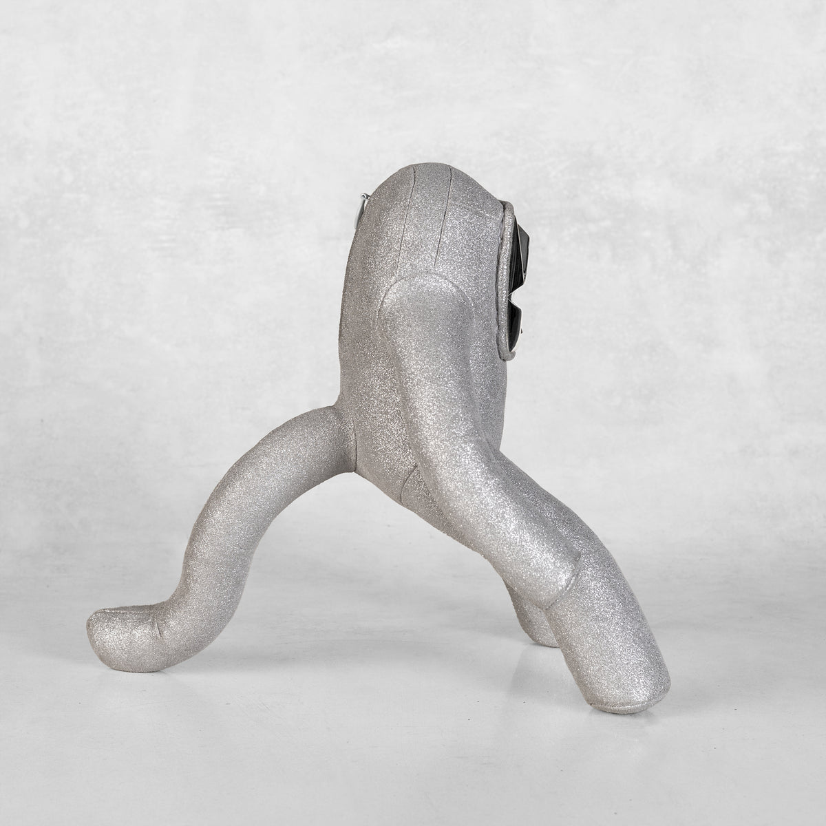 a silver leather and white brass toy art sculture