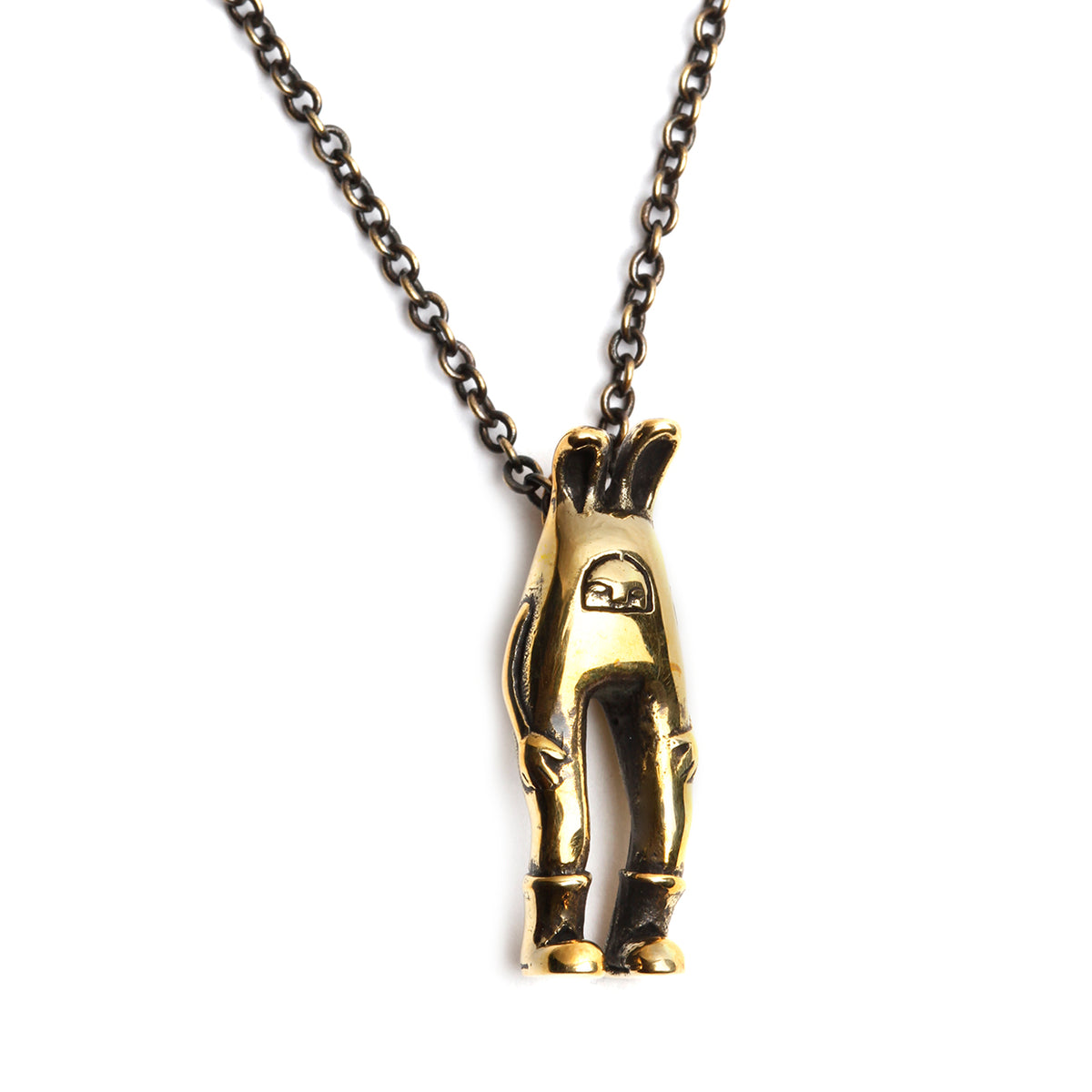 Gold bunny pendant on a chain against a white background