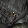 Closeups of details of a black crossbody bag