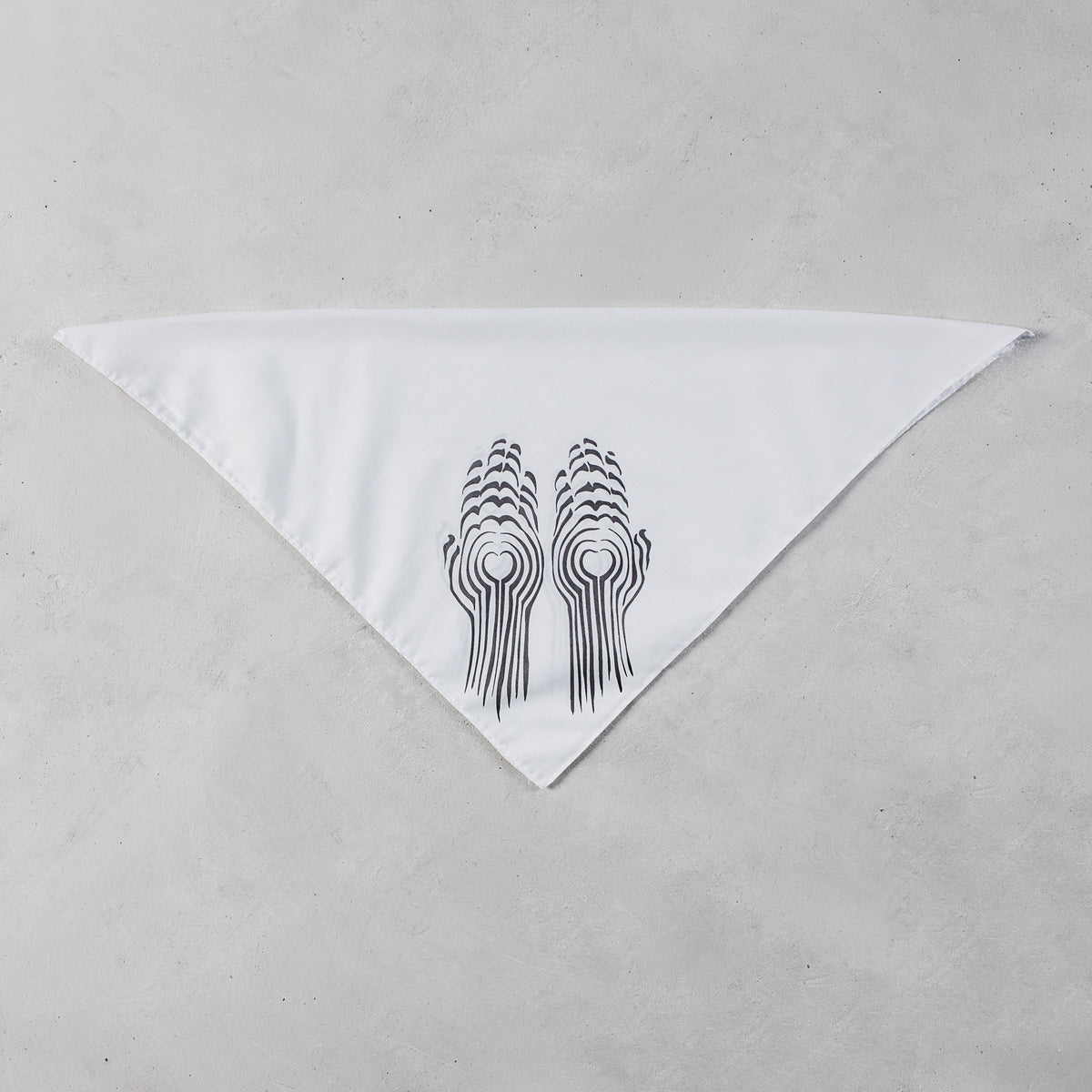 A white triangular bandana featuring a black graphic of two stylized hands holding circular elements, displayed flat on a textured light gray background.